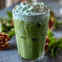 A creamy iced matcha latte with a luscious vanilla cold foam, perfect for Mother's Day celebrations.